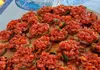 Tray of bruschetta topped with chopped fresh tomatoes served during a boat tour.