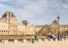 Louvre Museum and its iconic glass pyramid in Paris