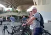 Guided bike tour group stopped near Seville’s Metropol Parasol (Las Setas) during a scheduled visit.