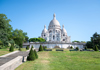 A group of tourists in Montmartre/Paris in front of the Basilica of Sacre Coeur with a guide from The Tour Guy.