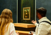 A tour group inside the Louvre Museum with their guide from The Tour Guy.