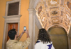 Tourists inside the Doge's Palace and admiring the artwork with a guide from The Tour Guy.