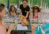 A group of tourists sitting at a table and receving their lunch while on tour with The Tour Guy.