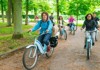 A family having a picnic next to the Grand Canal of Versailles while on tour with The Tour Guy.