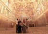 A family inside of the Sistine Chapel.