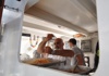 Man cooking pasta on a boat