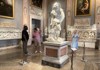 Two tourists looking at Bernini's David inside the Borghese Gallery while on tour with The Tour Guy.