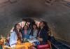 A group of tourists on a gondola ride in Venice while on tour with The Tour Guy.