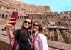 Two women taking a selfie from the 2nd level of the Colosseum while on tour with The Tour Guy.