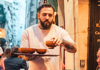 Waiter passing out French onion soup in Le Marais