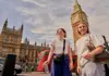 a group of tourists in front of Big Ben