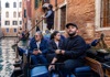 A man having his picture taken in front of Rialto Bridge while on tour with The Tour Guy.