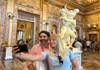 A female tourist taking a selfie inside the Borghese Gallery with her guide from The Tour Guy.