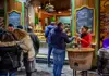 Street food stand in Naples with customers sampling fried snacks outside.