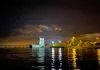 Belém Tower reflected on the Tagus River at night