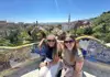 Two women sitting on a bench at Park Guell in Barcelona