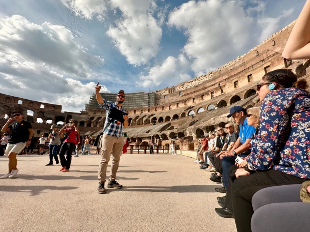 A tour group at the Colosseum on the Arena Floor with tour guide from The Tour Guy 