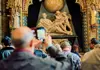 Private tour London in One Day PVT LDN 1 Day a tourist taking a picture of the inside of the Westminster Abbey building