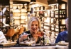 Woman having an aperitivo in a cocktail bar in Rome