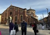people and tour guide in front of last supper