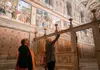 A group of tourists walking through the Hall of Maps inside the Vatican Museums while on tour with The Tour Guy.