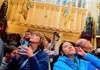 a group of tourists admiring the interior of Westminster Abbey 