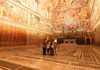 A guide and a family of tourists inside the Sistine Chapel while on tour with The Tour Guy.