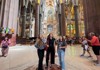 A group of tourists inside the Sagrada Familia.