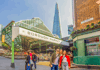 A photo of three tourists in front of Borough Market in London while on tour with The Tour Guy. 