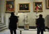 Tourists inside the Pamphili Gallery in Rome, Italy.