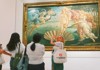 A group of tourists looking at the Birth of Venus in the Uffizi Gallery while on tour with The Tour Guy.