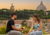 Couple drinking wine at sunset in Rome