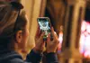 Visitor photographing architectural details inside a historic Paris church