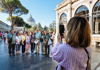 A group of tourists walking through the Hall of Maps inside the Vatican Museums while on tour with The Tour Guy.