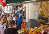 A guide showing lemons on a street stand in Sorrento