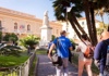 A group of people following the guide on a beautiful garden in Sorrento