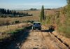 Jeep on dirt path in Tuscany