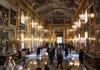 A picture of tourists inside of the Great Gallery Room inside of Palazzo Colonna in Italy. 