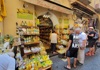 An image of tourists outside of a souvenior shop in Positano. 