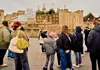 Tour London in One Day SGT LDN 1 Day a guide and a group of tourists outside the Tower of London