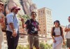 Tour guide with people looking at Montserrat 