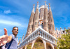 A tourist taking a selfie of the exterior of sagrada familia