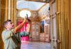 A tour guide explaining the history of the Place of Versailles.