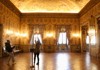 Tourists inside the ballroom of the Pamphili Gallery in Rome, Italy.