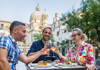 Man eating squid ink pasta in Venice. 