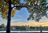 An image of the Tower of London in the distance with the River Thames in front.