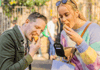 Two tourists eating sausage pie at the Borough Market in London while on a food tour with The Tour Guy.