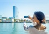 girl taking picture from boat