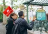 The Tour Guy guide leading visitors near a Paris Métro entrance