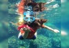 girl holding starfish
